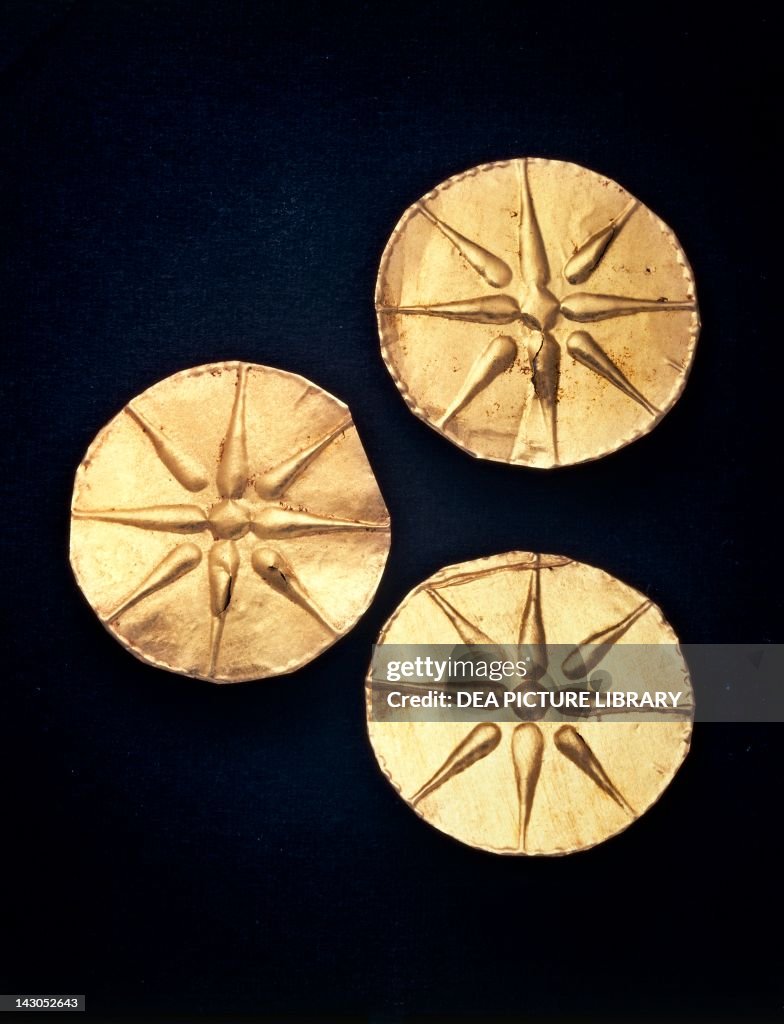 Gold discs with Macedonian star relief