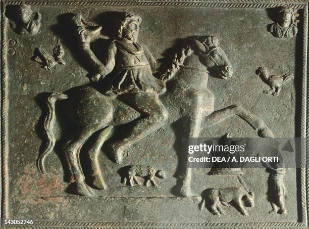 Rectangular plate depicting a knight with a rhyton in his hand, bronze, from Abritus, Bulgaria. Thracian Civilization, 2nd-3rd Century. Razgrad,...