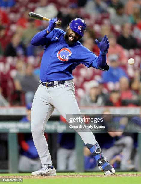 Franmil Reyes of the Chicago Cubs reacts after being hit by a pitch in the 9th inning against the Cincinnati Reds at Great American Ball Park on...