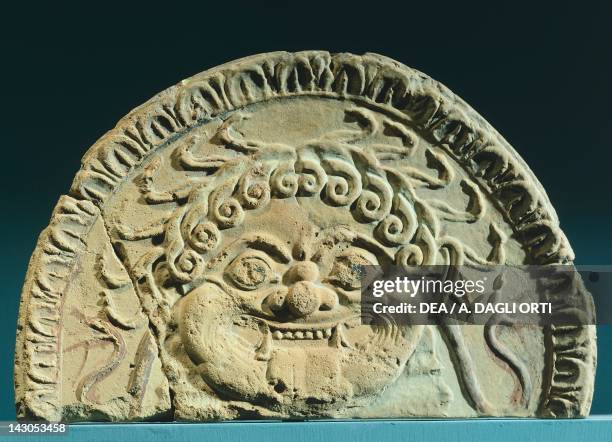 Relief depicting gorgoneion, ante fix in clay from the sanctuary of the necropolis in ancient Oisyme, Greece. Greek civilization, 6th Century BC....