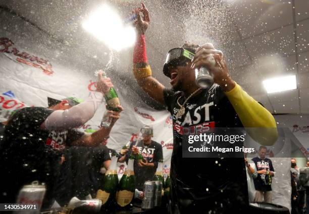 Ronald Acuna Jr. #13 of the Atlanta Braves celebrates after clinching the division against the Miami Marlins at loanDepot park on October 04, 2022 in...