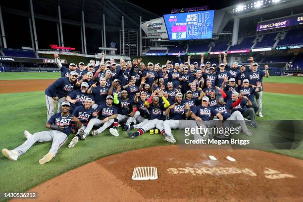 The Atlanta Braves pose for a group picture after clinching the division against the Miami Marlins at loanDepot park on October 04, 2022 in Miami,...