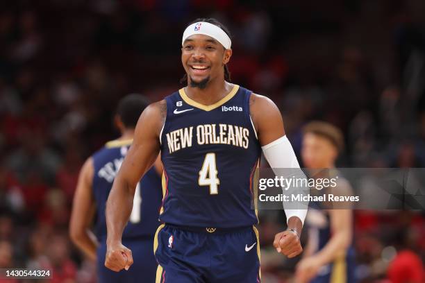 Devonte' Graham of the New Orleans Pelicans celebrates against the Chicago Bulls during the first half of a preseason game at the United Center on...