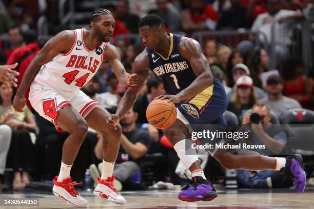 Zion Williamson of the New Orleans Pelicans drives to the basket against Patrick Williams of the Chicago Bulls during the first half of a preseason...