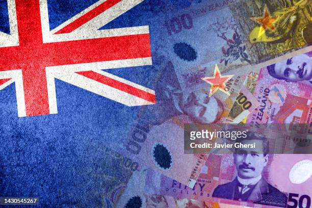 new zealand flag and new zealand dollar cash bills - new zealand exchange stock pictures, royalty-free photos & images