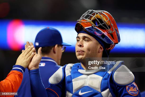 Francisco Alvarez of the New York Mets celebrates the win with teammates after the game against the Washington Nationals during game two of a double...