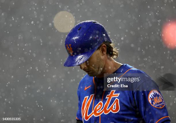 Jeff McNeil of the New York Mets walks back into the dugout after flying out in the sixth inning against the Washington Nationals during game two of...