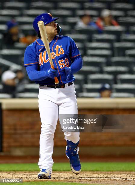 Francisco Alvarez of the New York Mets watches his solo home run in the sixth inning against the Washington Nationals during game two of a double...
