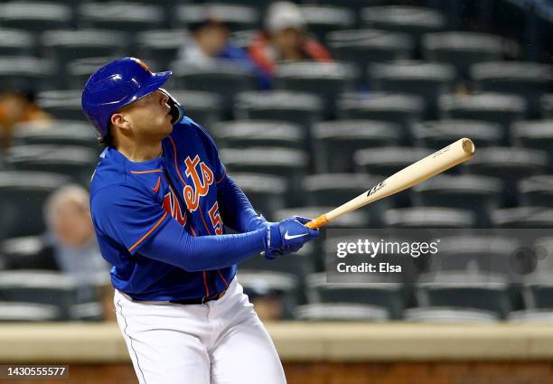 Francisco Alvarez of the New York Mets watches his solo home run in the sixth inning against the Washington Nationals during game two of a double...