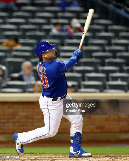 Francisco Alvarez of the New York Mets watches his solo home run in the sixth inning against the Washington Nationals during game two of a double...