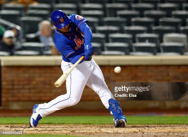 Francisco Alvarez of the New York Mets hits a solo home run in the sixth inning against the Washington Nationals during game two of a double header...