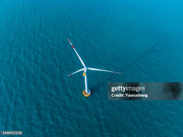 top view of wind turbine in the sea - wind turbine aerial stock pictures, royalty-free photos & images