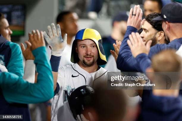 Cal Raleigh of the Seattle Mariners celebrates his home run in the fifth inning against the Detroit Tigers at T-Mobile Park on October 04, 2022 in...