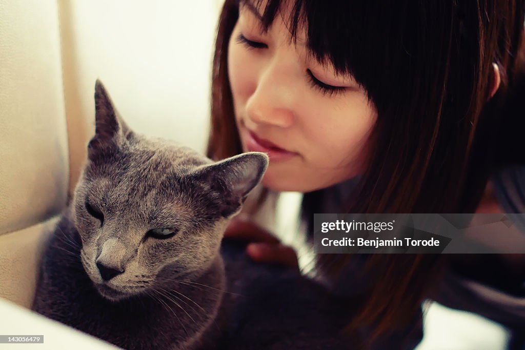 Japanese girl and cat on sofa