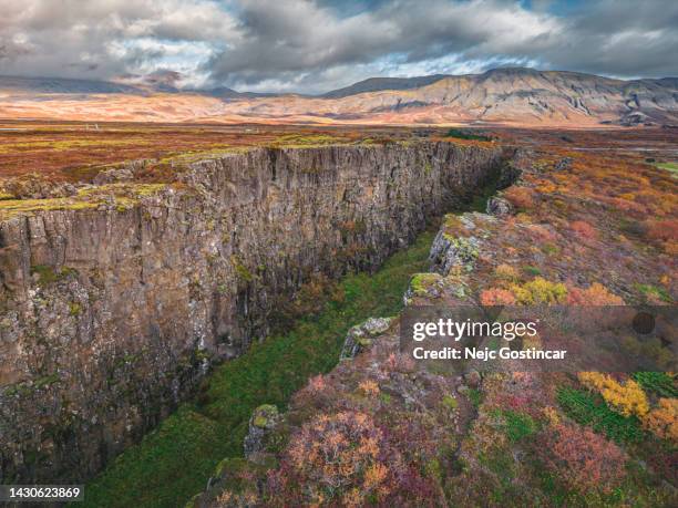 vertical aerial photo of two tectonic plates in iceland at sunset, amazing view - thingvellir national park stock pictures, royalty-free photos & images