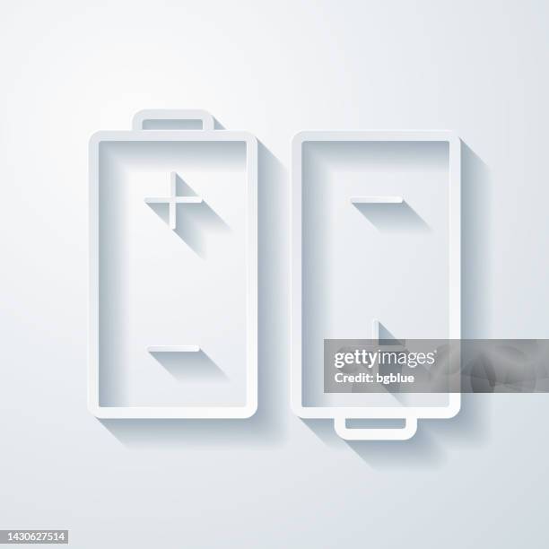 two batteries. icon with paper cut effect on blank background - lithium stock illustrations