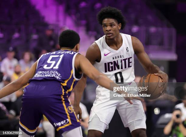 Scoot Henderson of G League Ignite is guarded by Tremont Waters of Boulogne-Levallois Metropolitans 92 in the first quarter of their exhibition game...
