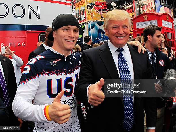 Olympic hopeful and BMX rider Connor Fields poses with Donald Trump during the Team USA Road to London 100 Days Out Celebration in Times Square on...