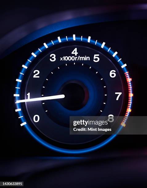 a lit up car dashboard guage, rev counter - drehzahlmesser stock-fotos und bilder