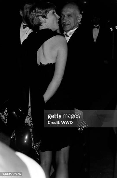 Alison Sutcliffe and Ben Kingsley attend a party at Spago in West Hollywood, California, on March 30, 1992.