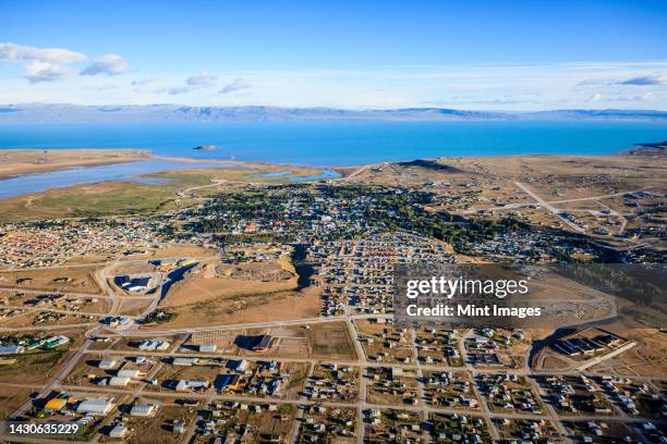 aerial view of el calafate, a sprawing town on the coast, a sea channel, on the edge of the southern patagonian ice field - santa cruz province argentina stock pictures, royalty-free photos & images