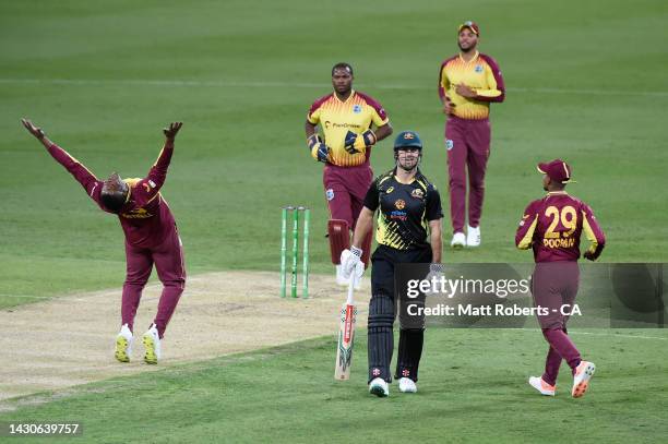 Sheldon Cottrell of West Indies celebrates the wicket of Mitchell Marsh of Australia during game one of the T20 International series between...