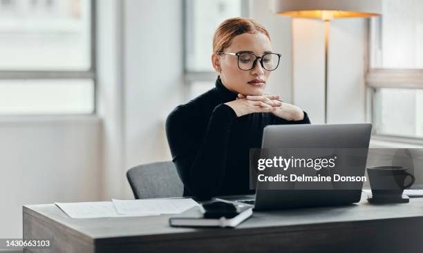thinking, planning and receptionist working on laptop in an office, planning and contemplating career change. vision, goal and mission by young  employee bored at her desk job, focused on online task - bureau de change stockfoto's en -beelden