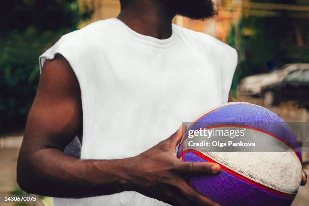 black young man wearing a white t-shirt, rear view. mockup. - blank t shirt stock pictures, royalty-free photos & images