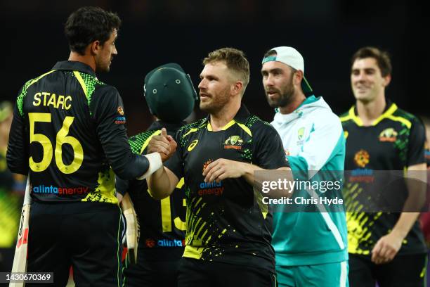 Aaron Finch of Australia celebrates winning game one of the T20 International series between Australia and the West Indies at Metricon Stadium on...