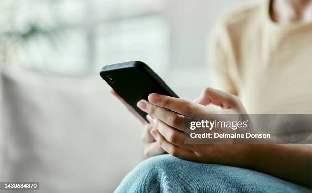 person hands with smartphone for mobile app, social media or online networking on home wifi or internet. woman with cellphone technology reading digital news or check website for information contact - notification stockfoto's en -beelden