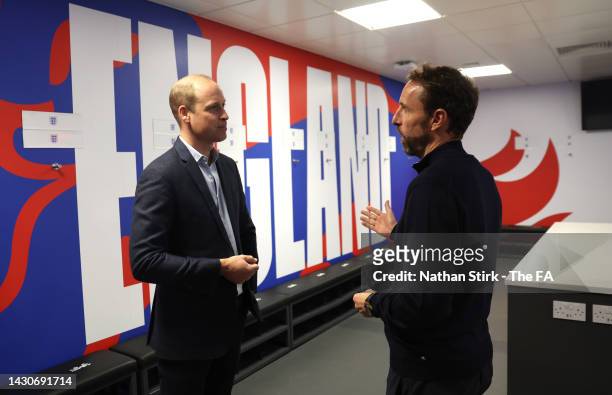 Prince William, Prince of Wales interacts with Gareth Southgate, manager of England during the 10th anniversary at St George's Park on October 5,...