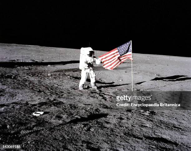Flag On The Moon, Apollo 12 Astronaut Charles 'Pete' Conrad Stands Beside The U.S, Flag After It Was Unfurled On The Lunar Surface On Nov 1969,...