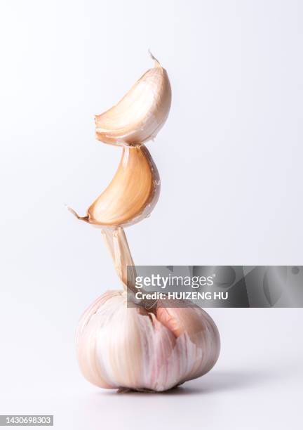 cloves of garlic stack - garlic clove stock pictures, royalty-free photos & images