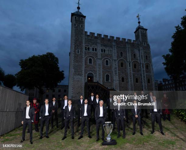 In this photograph released today, the players from Team Europe and Team World pose for a photograph with the trophy in-front of Tower Of London...