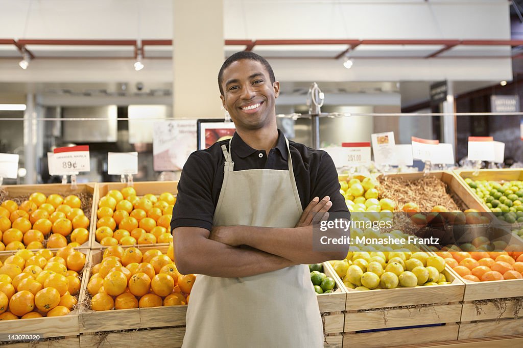 Worker smiling in supermarket