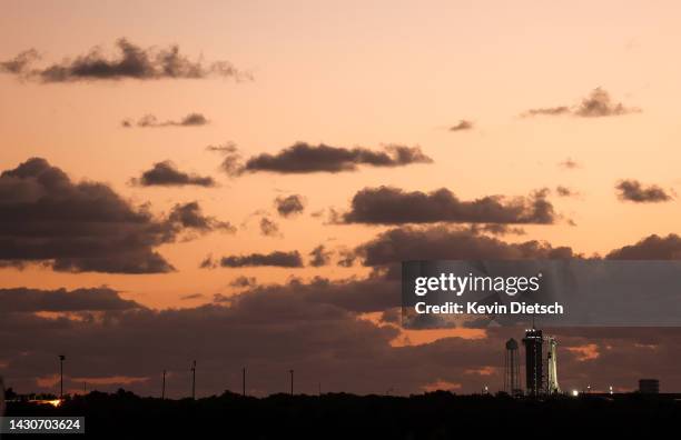 The sun begins to rise over the SpaceX Falcon 9 rocket with the Dragon spacecraft Endurance atop as final preparations are underway for the launch of...