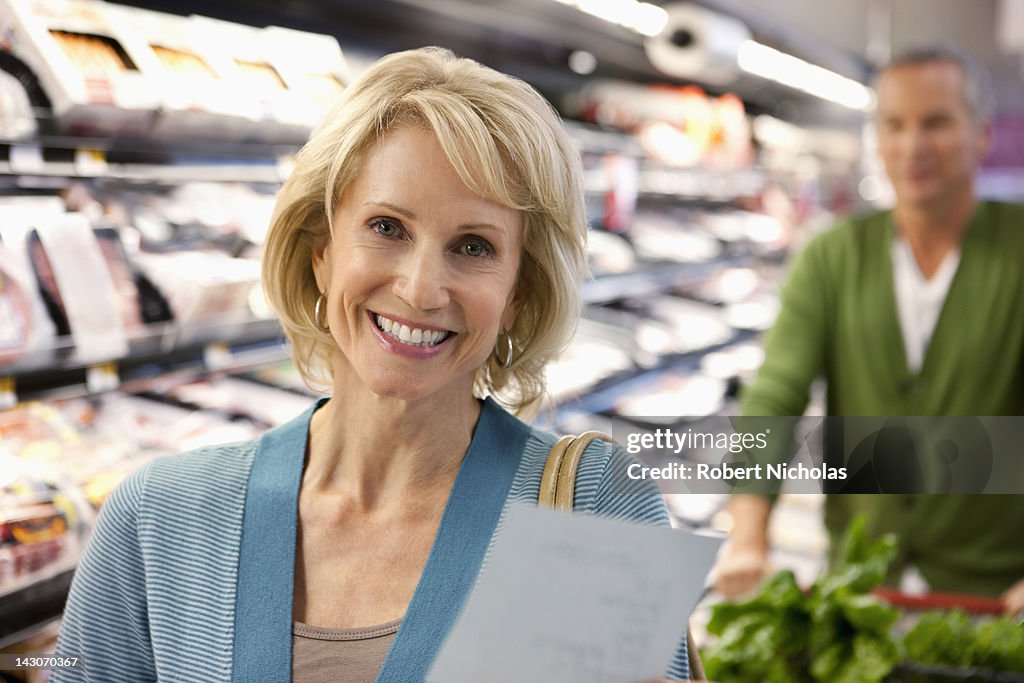 Older couple shopping in supermarket