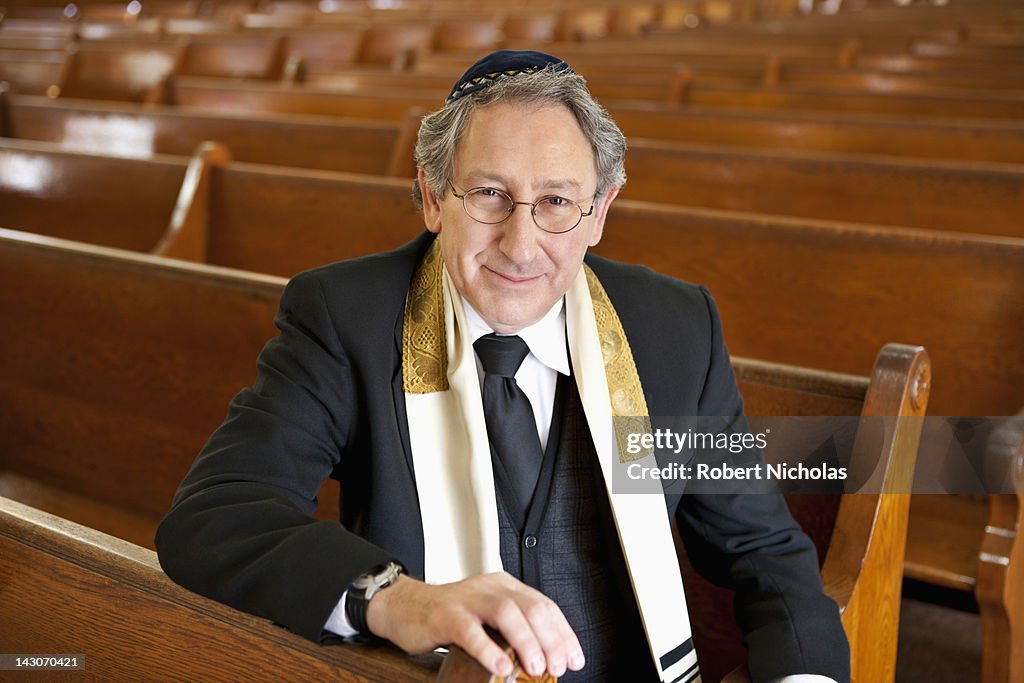 Rabbi sitting in synagogue
