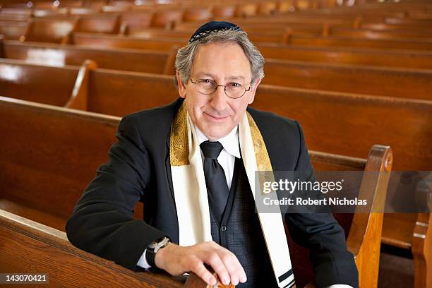 rabbi sitting in synagogue - jewish religion stock pictures, royalty-free photos & images