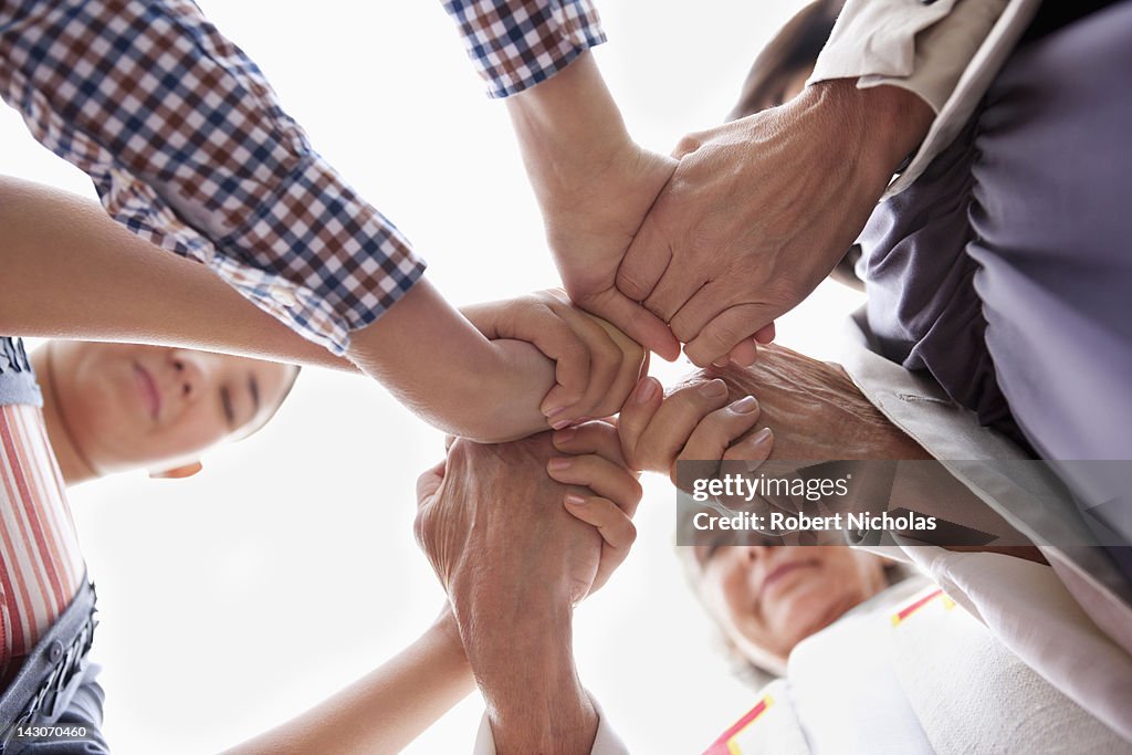 Group of hands clasped in prayer