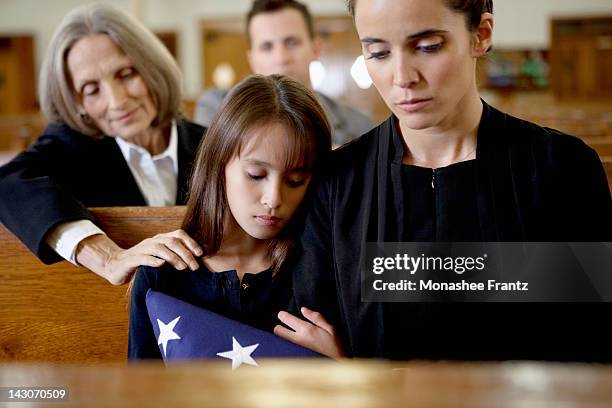 mother and daughter at military funeral - mourning parent stock pictures, royalty-free photos & images