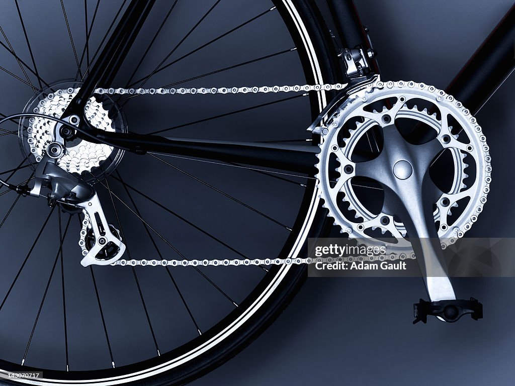 Close up of bicycle chain, pedal and gears