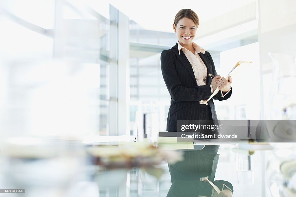 Businesswoman standing in conference room