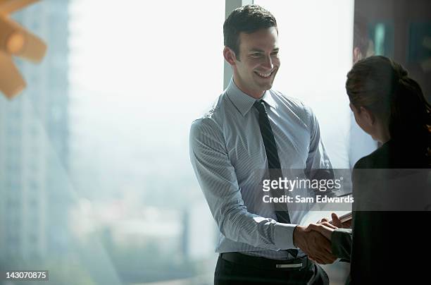 business people shaking hands in office - dedication stock pictures, royalty-free photos & images