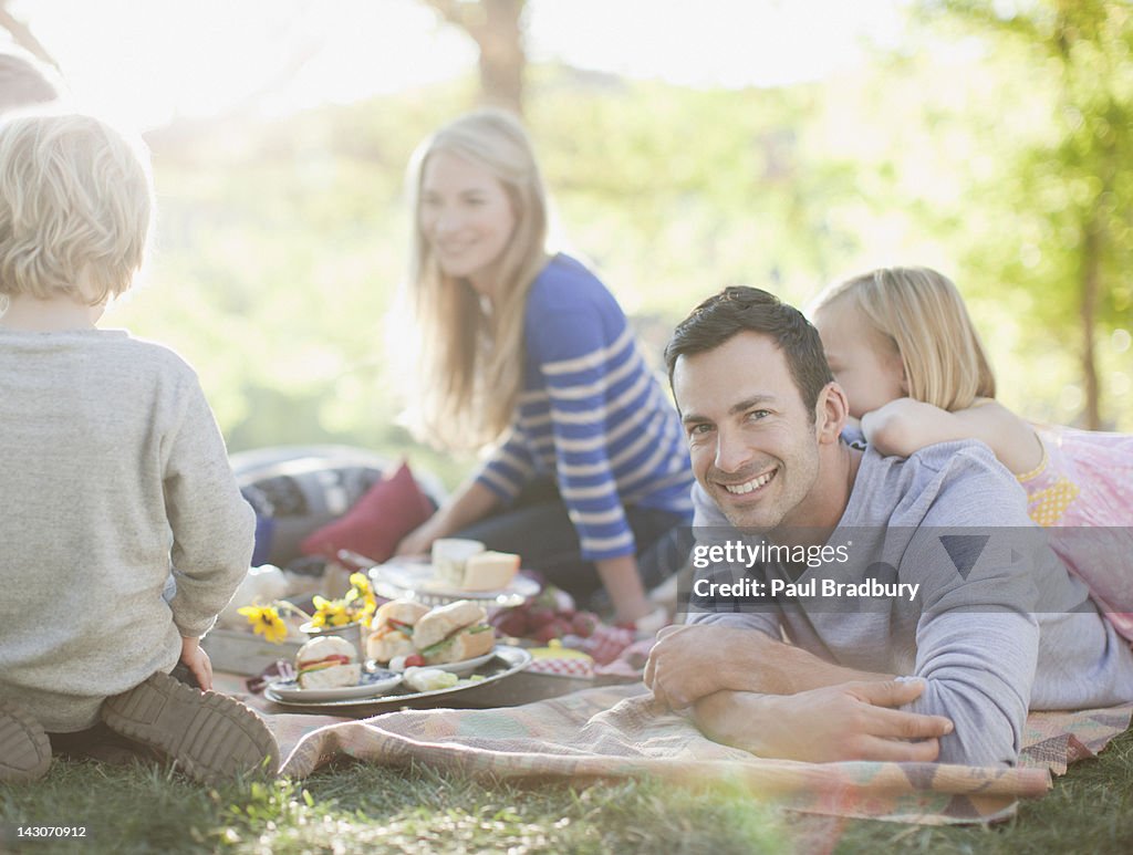 Family picnicking together on grass
