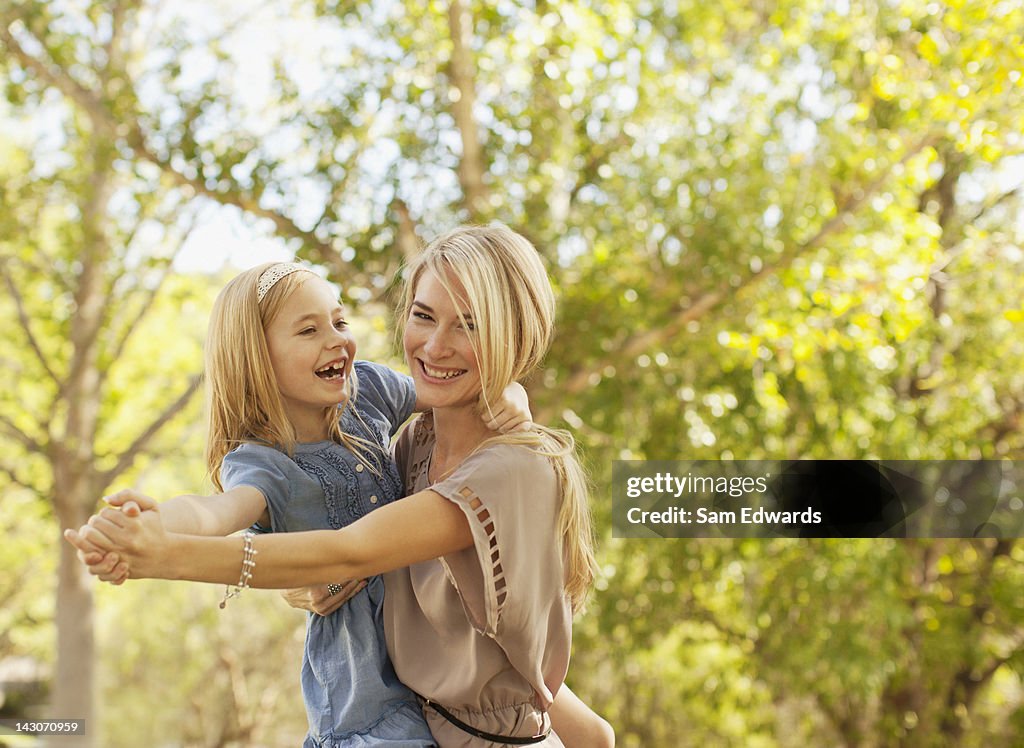 Mother and daughter playing outdoors
