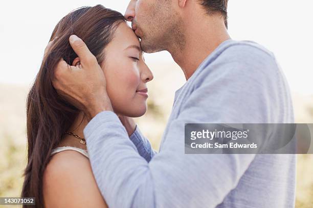 close up of couple kissing - asian couple kissing stockfoto's en -beelden