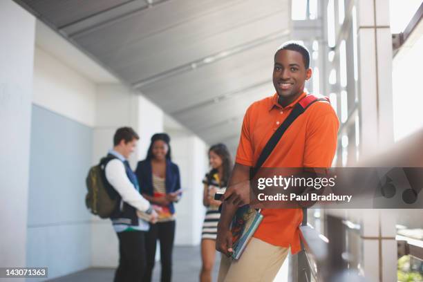 student smiling in hallway - multi-cultural minority groups stock pictures, royalty-free photos & images