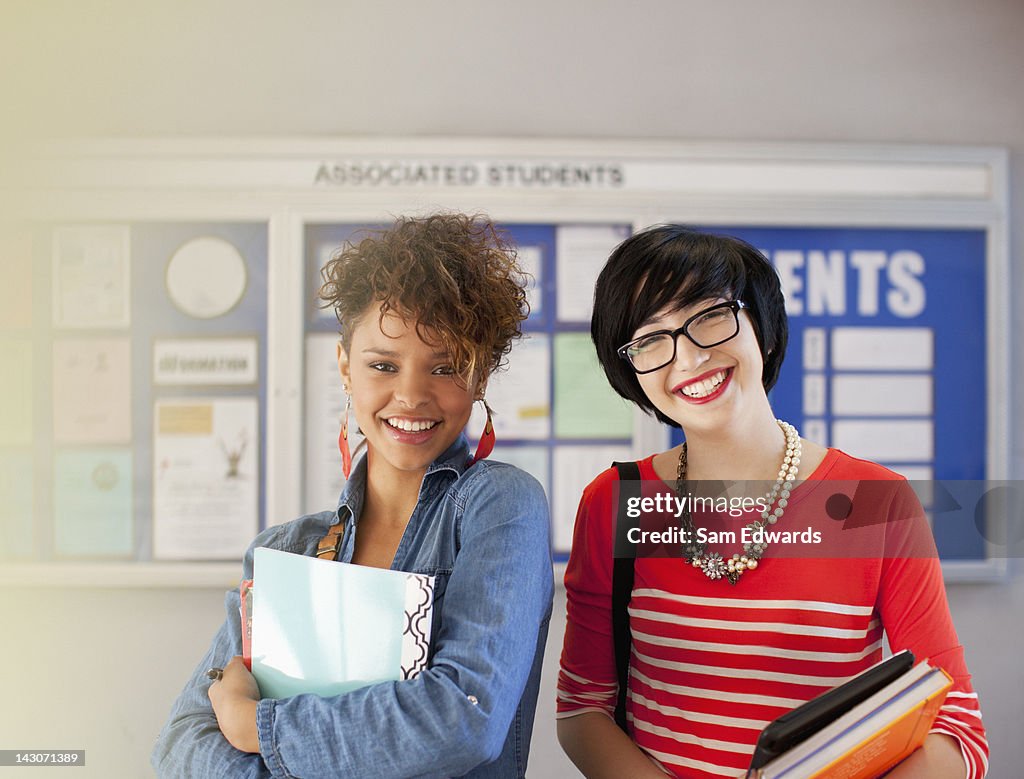 Students smiling together in hallway