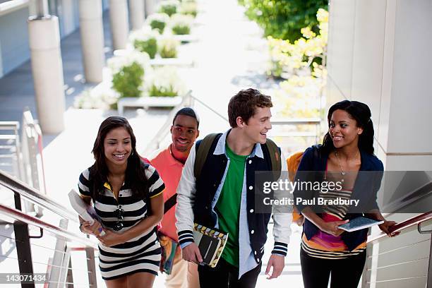 students climbing steps together - philippines friends stock pictures, royalty-free photos & images